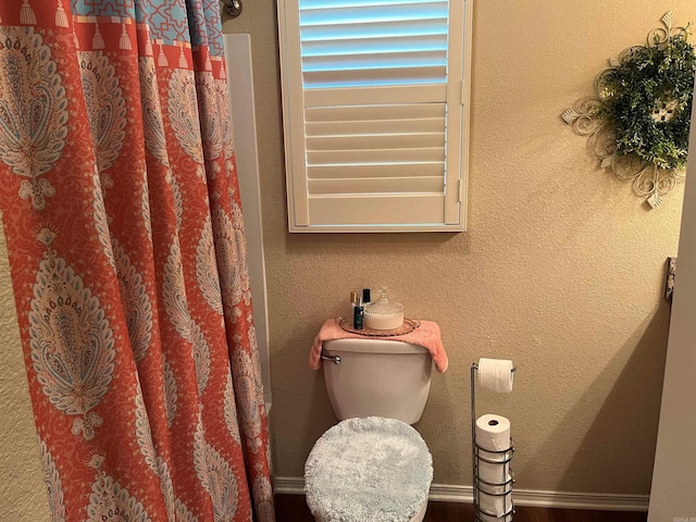 bathroom featuring toilet