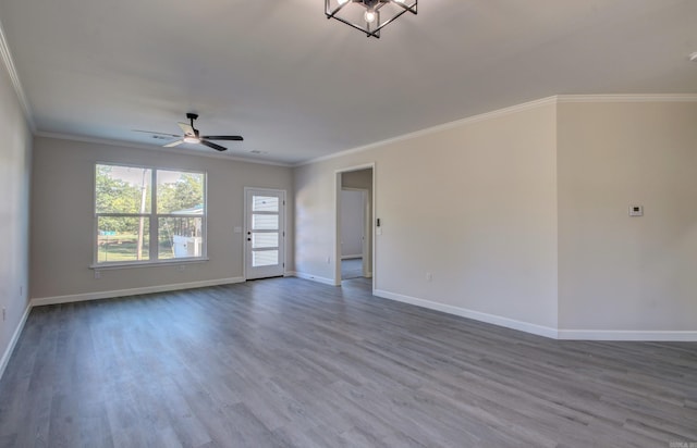 unfurnished room with ornamental molding, hardwood / wood-style floors, and ceiling fan