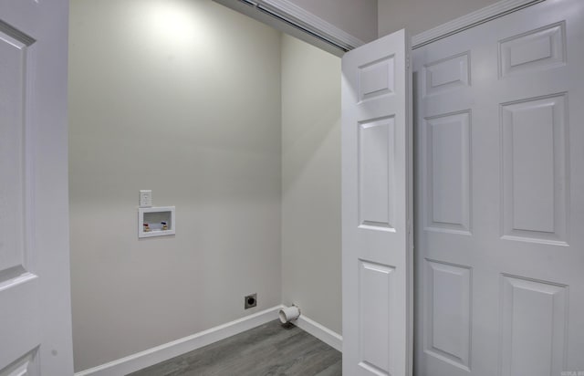 laundry area with hookup for a washing machine, dark hardwood / wood-style flooring, and electric dryer hookup