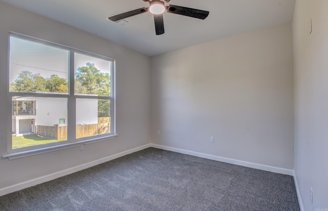 carpeted empty room featuring ceiling fan