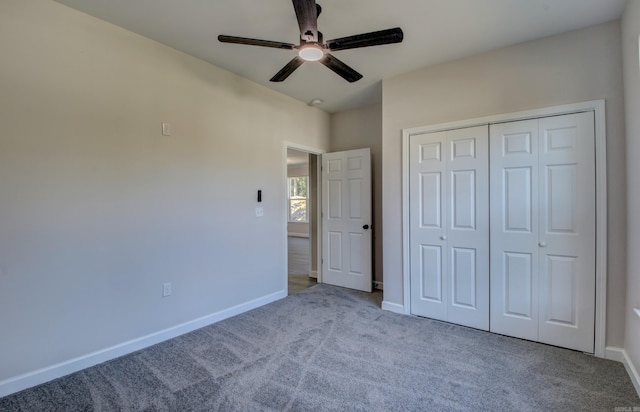 unfurnished bedroom with ceiling fan, a closet, and light colored carpet