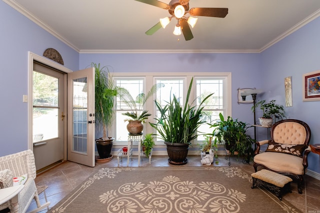 unfurnished room with a healthy amount of sunlight, ceiling fan, and crown molding