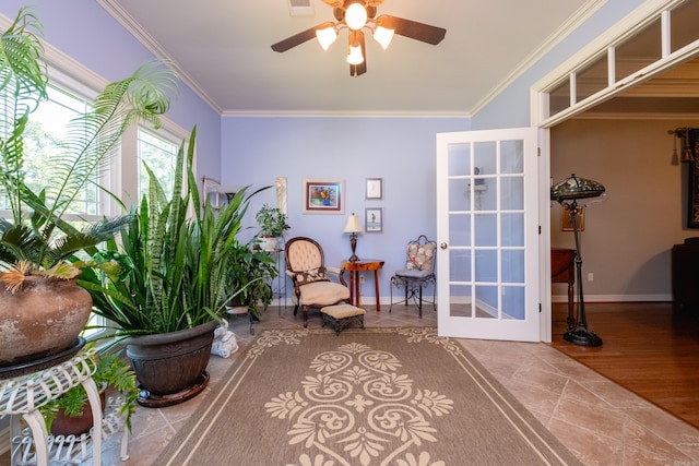 sitting room featuring crown molding, ceiling fan, and wood-type flooring