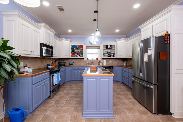 kitchen with blue cabinetry, a kitchen island, decorative light fixtures, wood counters, and stainless steel appliances