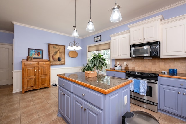 kitchen with white cabinets, pendant lighting, ornamental molding, a kitchen island, and stainless steel appliances