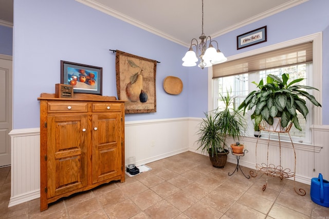 dining room with a notable chandelier and crown molding