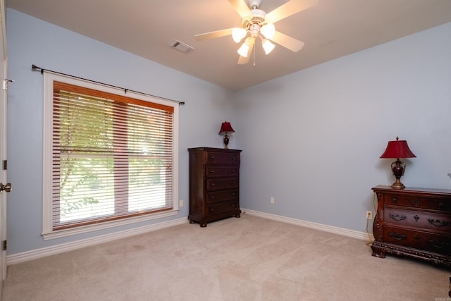 misc room with ceiling fan and light carpet