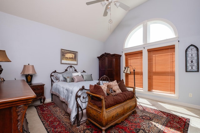 bedroom featuring ceiling fan, carpet floors, and high vaulted ceiling