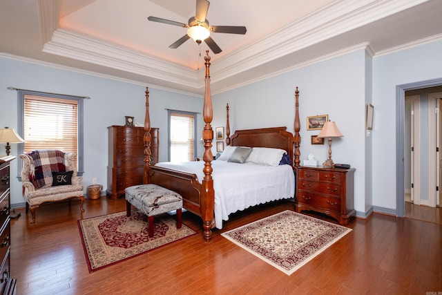 bedroom featuring multiple windows, ceiling fan, and dark wood-type flooring