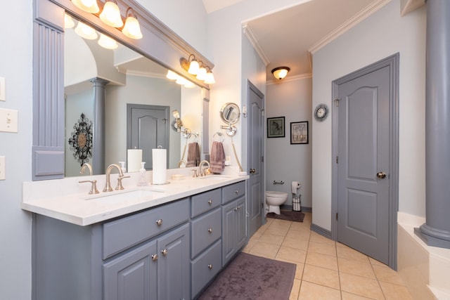 bathroom with vanity, toilet, tile patterned floors, crown molding, and ornate columns