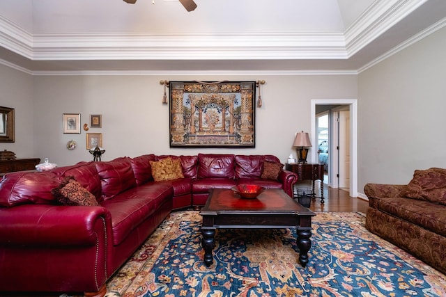 living room featuring ornamental molding, hardwood / wood-style flooring, and ceiling fan