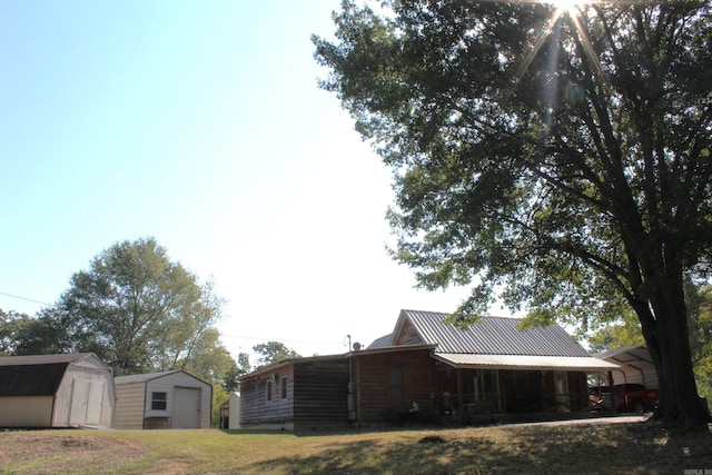 view of side of property with a shed