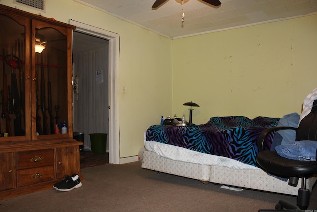 bedroom featuring ceiling fan and carpet flooring