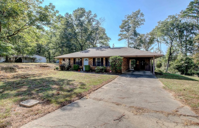 ranch-style home with a front yard and a carport