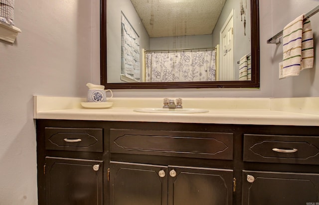 bathroom featuring vanity and a textured ceiling