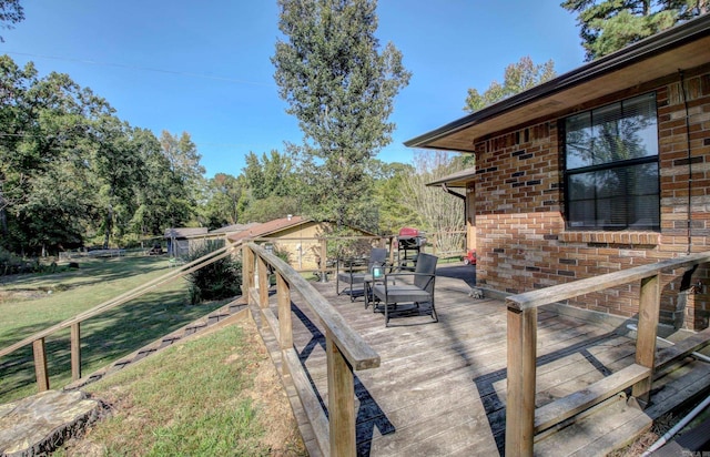 deck featuring a lawn