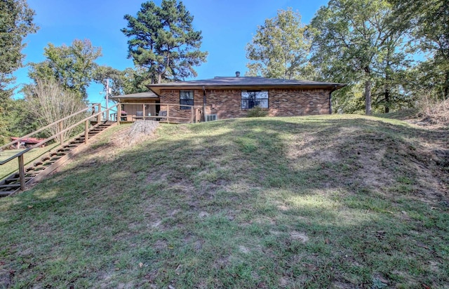 rear view of house with a lawn