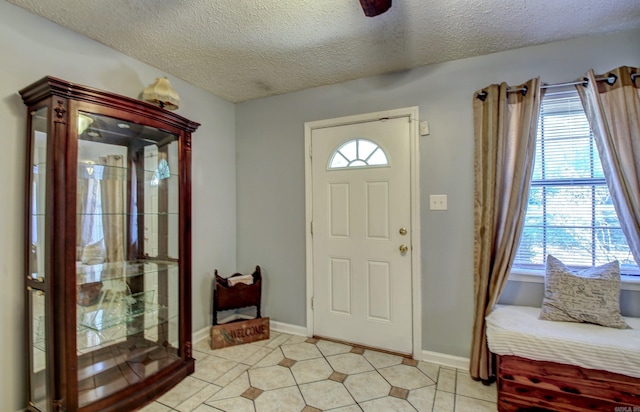 entryway with a textured ceiling