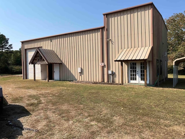 view of outbuilding featuring a lawn