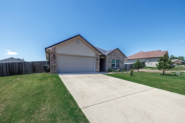 ranch-style home with a garage and a front lawn