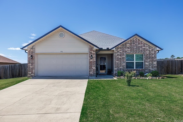 ranch-style home featuring a front yard and a garage