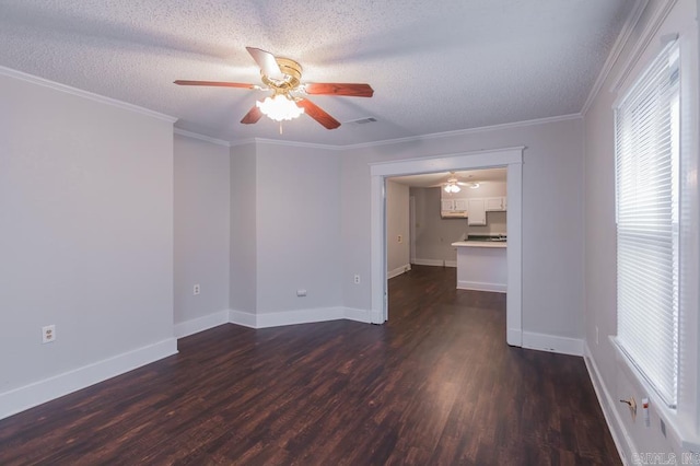 unfurnished room with ceiling fan, ornamental molding, dark hardwood / wood-style flooring, and a textured ceiling