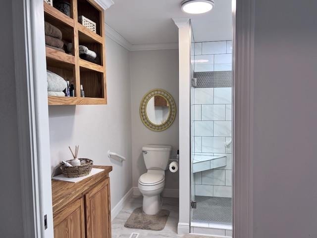 bathroom featuring crown molding, a shower with shower door, and toilet