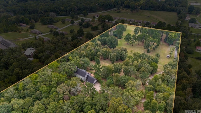 birds eye view of property with a rural view