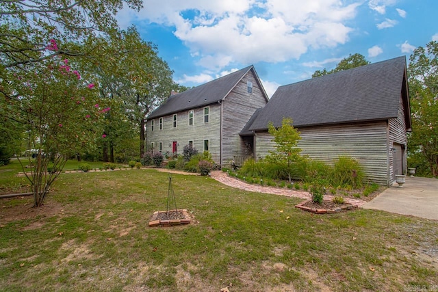 view of property exterior with a lawn