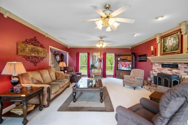 carpeted living room with ceiling fan, a brick fireplace, and crown molding