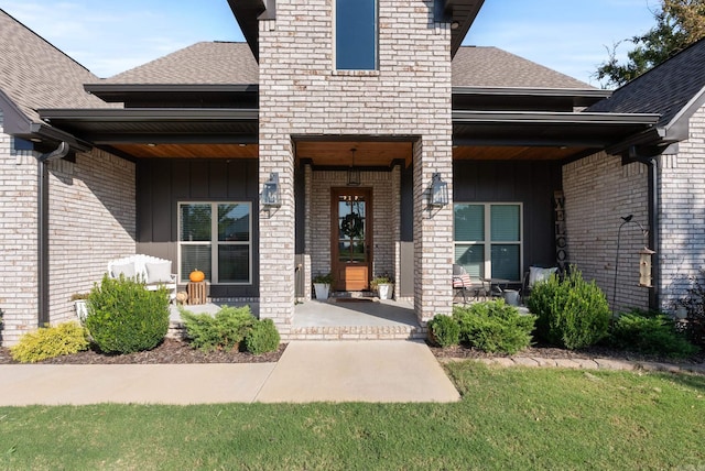 doorway to property with a yard