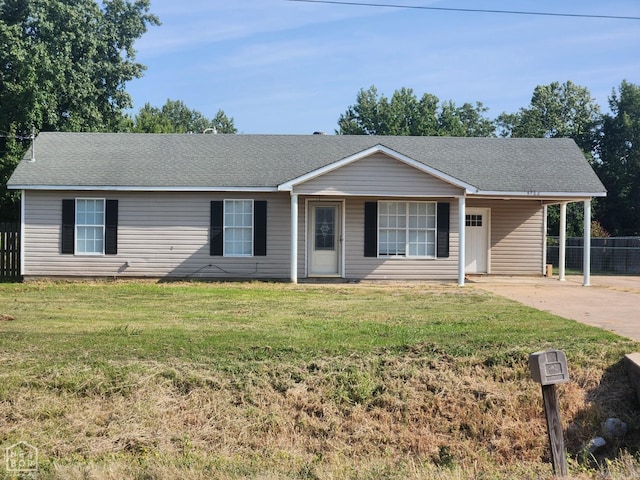 ranch-style home with a carport and a front yard