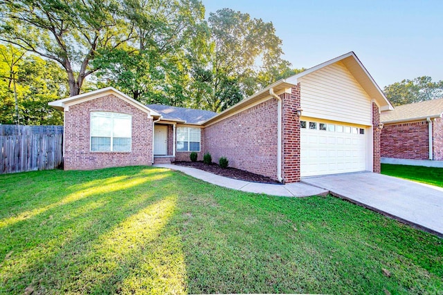 ranch-style house with a garage and a front lawn