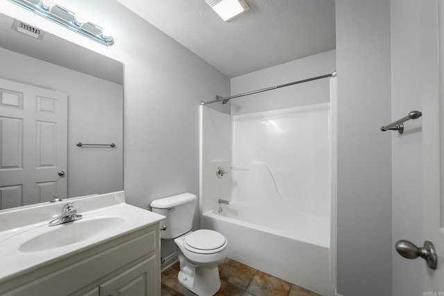 full bathroom featuring vanity, toilet, a textured ceiling, shower / bathing tub combination, and tile patterned flooring