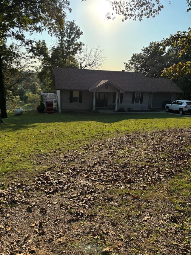 ranch-style house featuring a yard