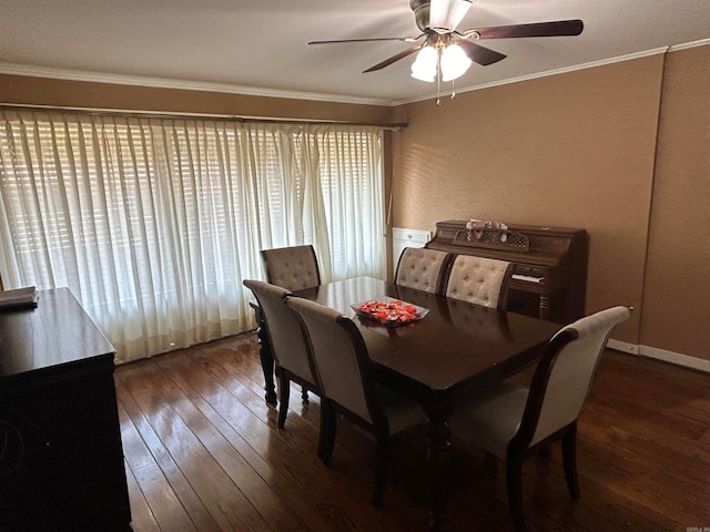 dining space with ornamental molding, ceiling fan, and dark wood-type flooring