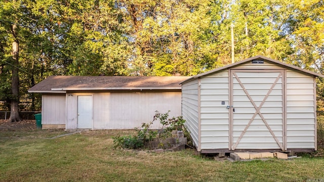 view of outbuilding featuring a yard