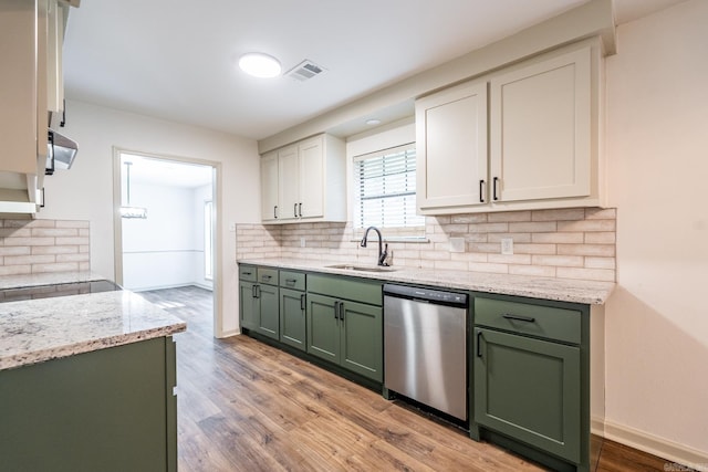 kitchen with sink, light hardwood / wood-style floors, white cabinetry, green cabinets, and dishwasher