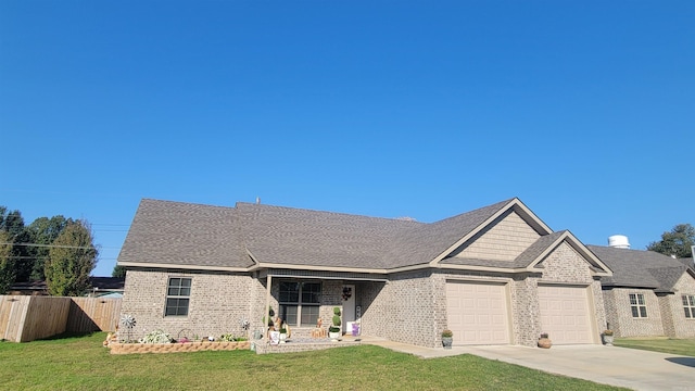 view of front of house with a garage and a front lawn