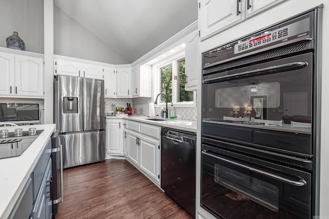 kitchen featuring white cabinets, lofted ceiling, dark hardwood / wood-style floors, and black appliances