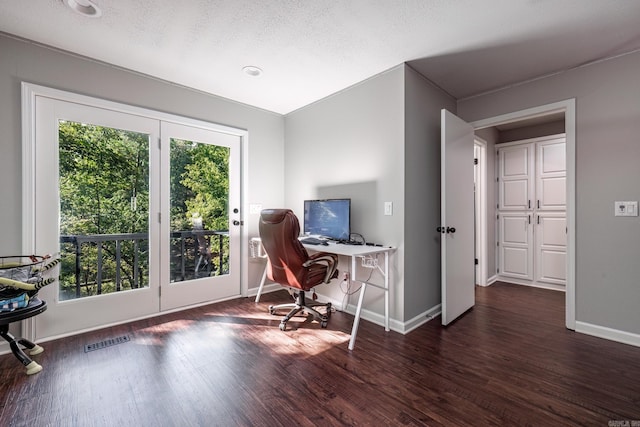 office space with a textured ceiling and dark hardwood / wood-style flooring