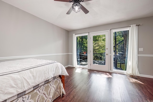 bedroom featuring multiple windows, ceiling fan, dark hardwood / wood-style flooring, and access to outside