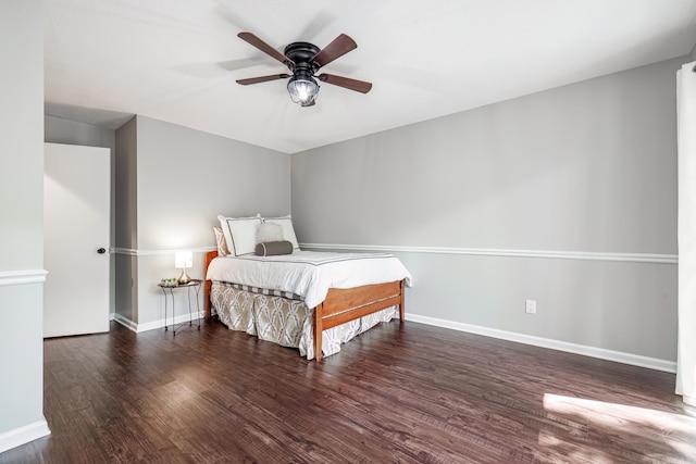 bedroom featuring ceiling fan and dark wood-type flooring