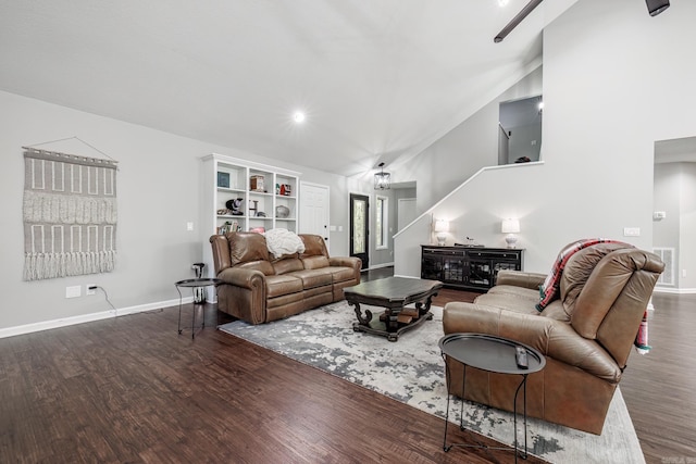 living room with vaulted ceiling and dark hardwood / wood-style floors