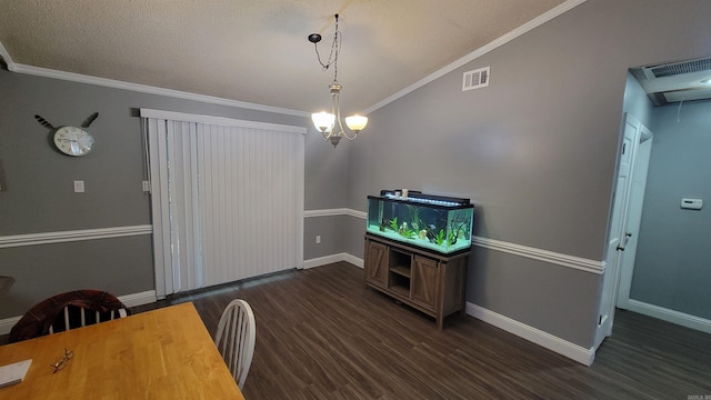 dining room featuring a textured ceiling, crown molding, dark hardwood / wood-style flooring, and a chandelier