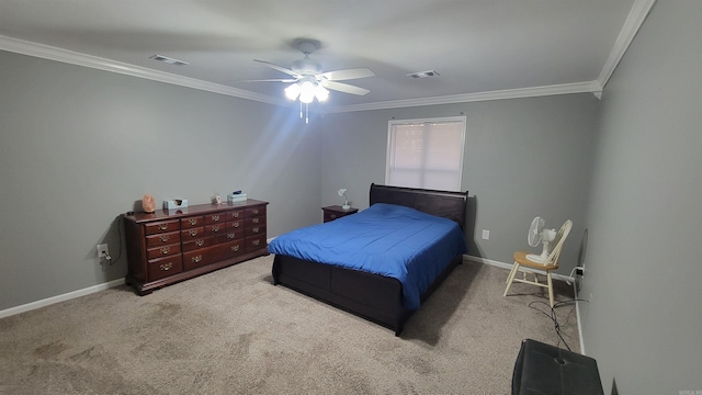 carpeted bedroom with ornamental molding and ceiling fan