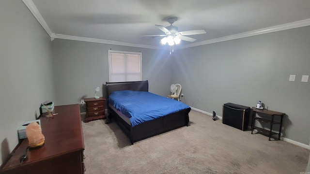 carpeted bedroom featuring crown molding and ceiling fan