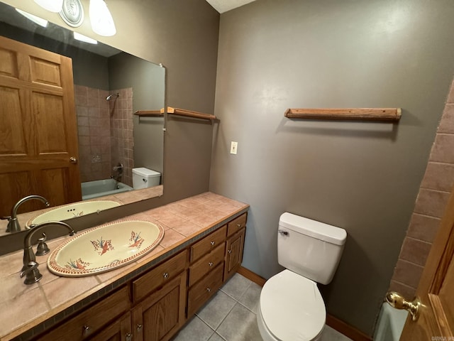 full bath featuring tile patterned floors, vanity, toilet, and tub / shower combination