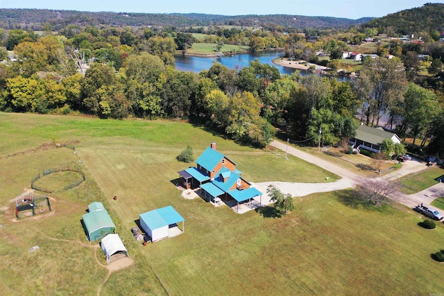 drone / aerial view featuring a rural view and a water view