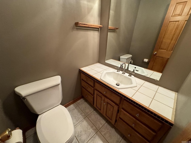 half bath featuring toilet, tile patterned floors, and vanity